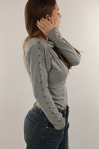 Maglia asimmetrica borchie